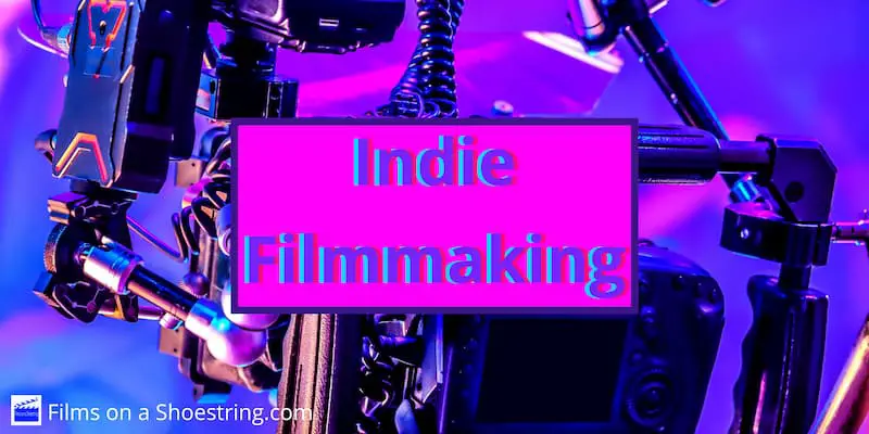 Indie Filmmaking title card in front of filmmaking camera during principal photography